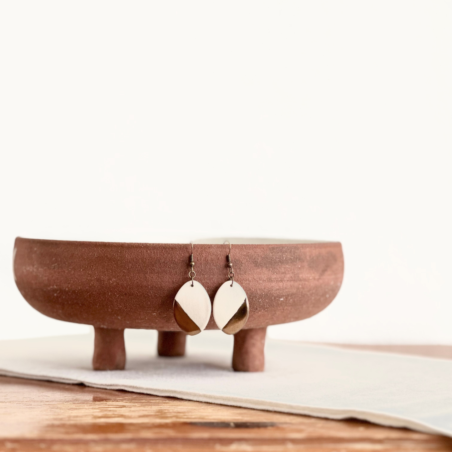 White Oval Ceramic Earrings (Gold Dipped)