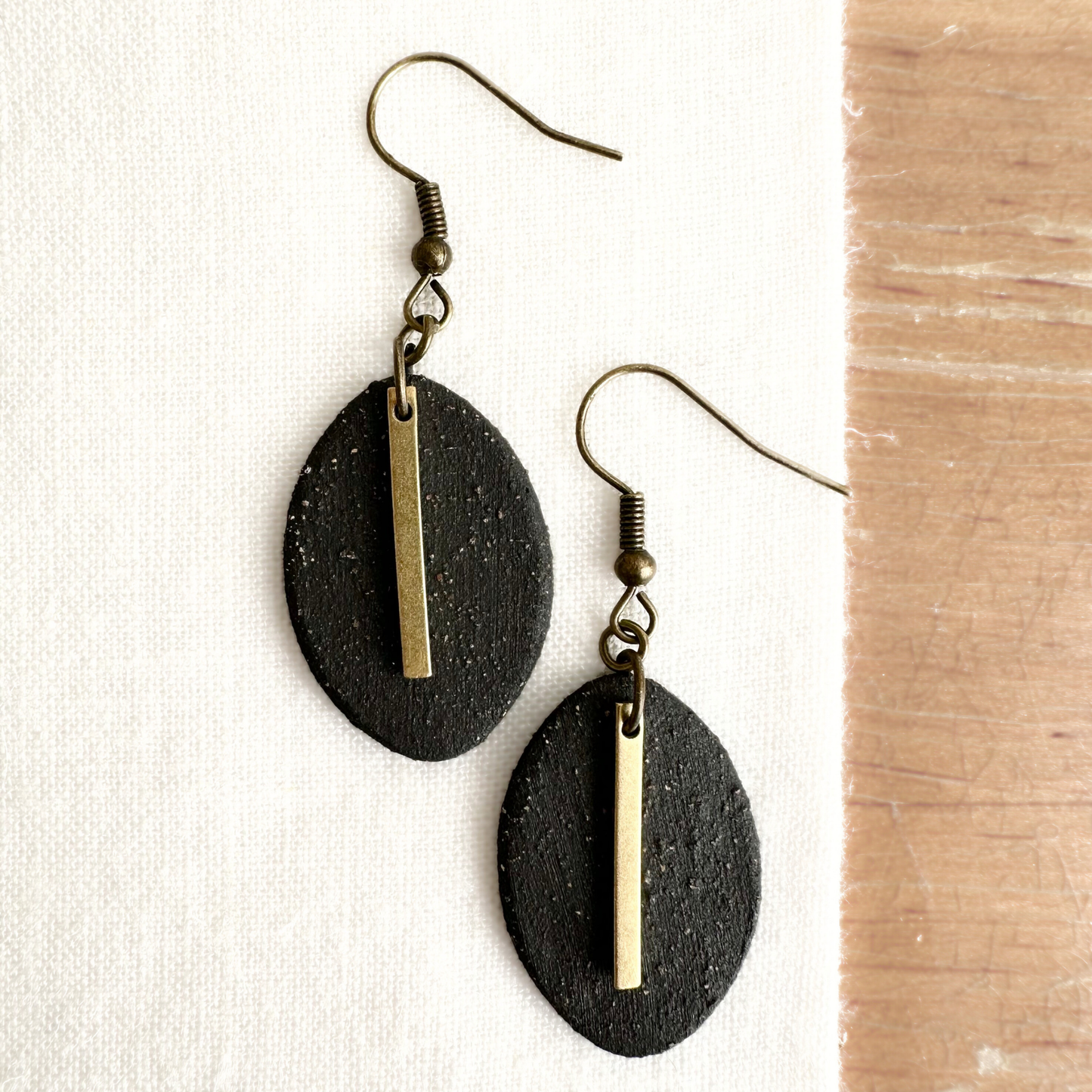 Handmade Ceramic Earrings (Black, Oval, Gold Charmed)